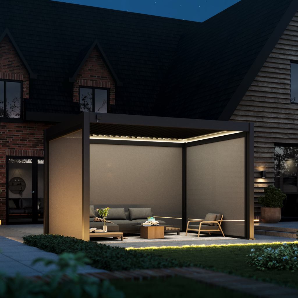Hygge aluminium pergola with the louvred roof open and the lighting on at dusk
