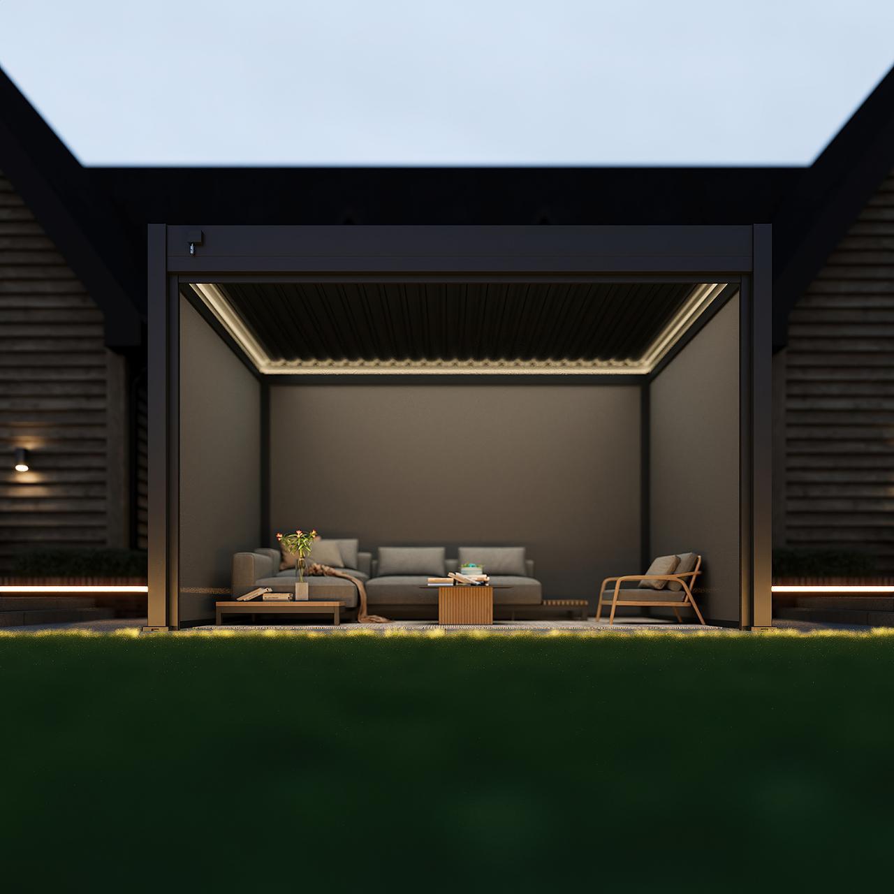 Dark grey pergola with timber slats and LED lighting, placed on a wooden deck with comfortable garden sofas and ambient garden lighting.