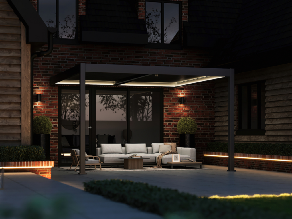 Stylish dark grey aluminium pergola at night, illuminated with integrated LED lighting for an ambient outdoor space.