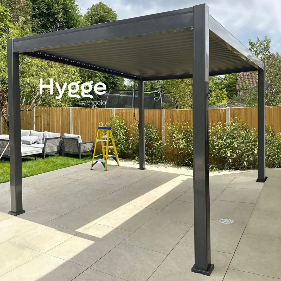Open-air pergola with aluminium louvres, placed on a contemporary patio for outdoor living.